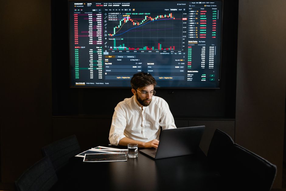Trader reviewing risk management journal and payout confirmation on a laptop