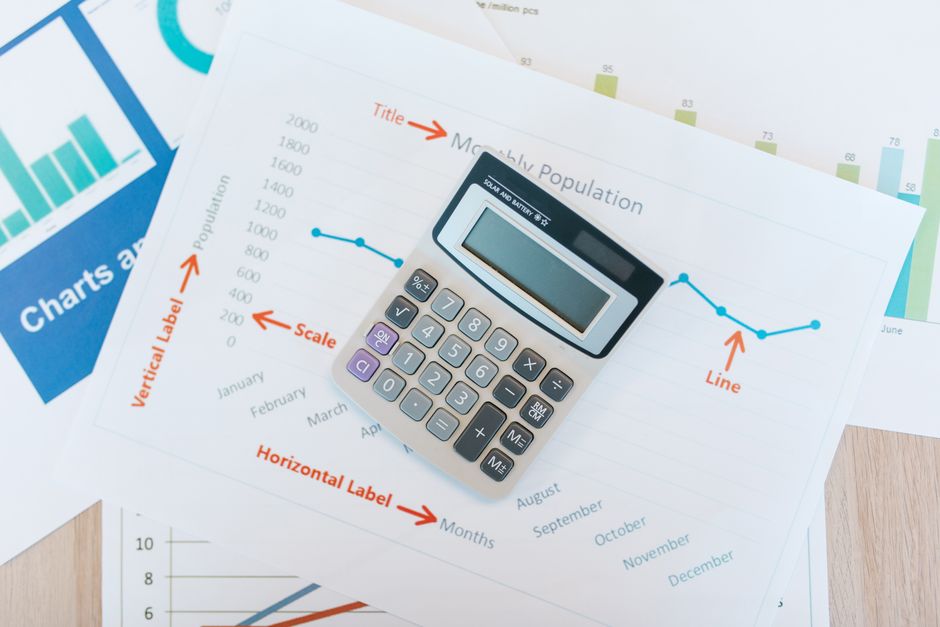 Financial calculation workspace with market reports and evaluation data
